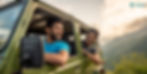 Two men smile and lean out of a green SUV's windows in a mountainous landscape. The sky is cloudy. "POOlit" logo appears in the corner.