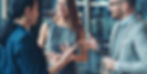 Three people talking to each other in a professional manner, they are trying to build a professional network