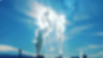Factories producing white smoke with blue sky as the background