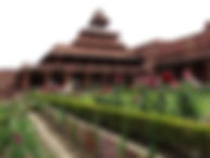 an image of Fatehpur sikri with pink flowers in the front in a garden used on the webpage of POOLit the carpool app