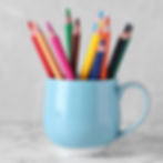 Colour pencils in a used mug