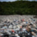 Green land is covered with non disposable waste due to pollution
